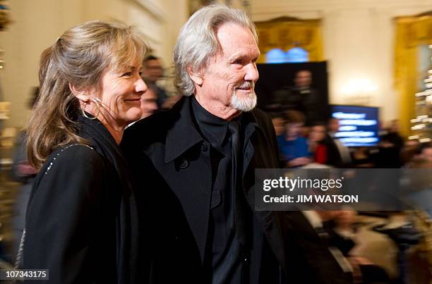 American writer, singer-songwriter, actor, and musician Kris Kristofferson and his wife Linda arrive for US President Barack Obama's remarks in the...