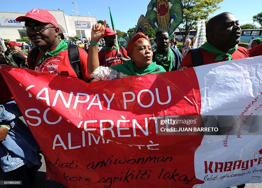 Environmental activists take part in a m