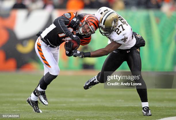 Malcolm Jenkins of the New Orleans Saints tackles Jordan Shipley of the Cincinnati Bengals during the NFL game at Paul Brown Stadium on December 5,...