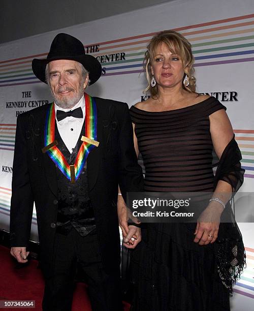 Merle Haggard and Theresa Ann Lane pose for photos during the 33rd Annual Kennedy Center Honors at the Kennedy Center Hall of States on December 5,...