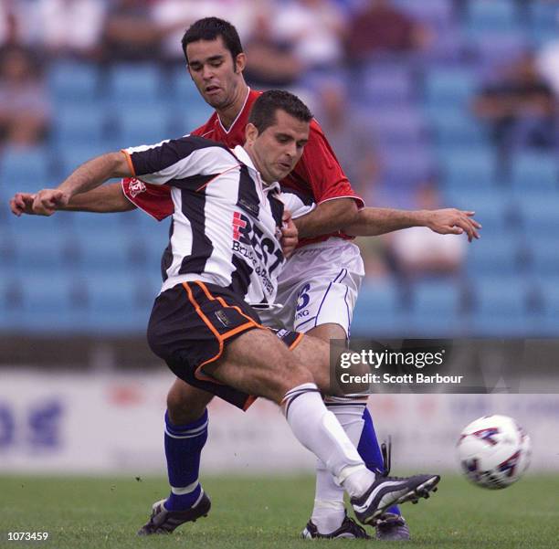 Alex Moreira of Adelaide City is tackled by Ante Deur of Sydney United during the NSL match between Sydney United and Adelaide City Force held at the...