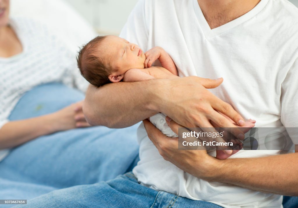 Father Holding Newborn Son