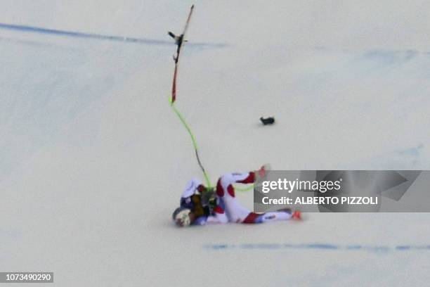 Switzerland's Marc Gisin falls during the FIS Alpine World Cup Men Downhill on December 15, 2018 in Val Gardena - Groeden, Italian Alps.