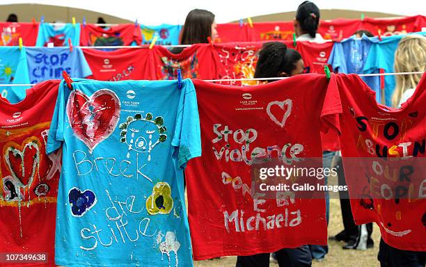 Shirts painted with messages of support hang on clothes lines at the Saartjie Baartman Centre, Athlone on December 3, 2010 in Cape Town, South...