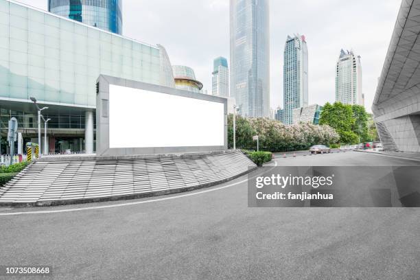 a big blank billboard on city street,guangzhou city - office placard stock pictures, royalty-free photos & images