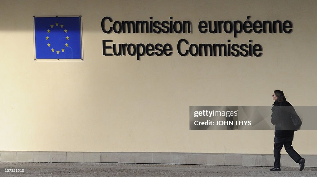 A woman walks out of the Berlaymont buil