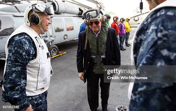 Secretary of Defense Robert Gates arrives aboad the USS Abraham Lincoln December 6, 2010 in the Arabian Sea. Gates toured the aircraft carrier and...