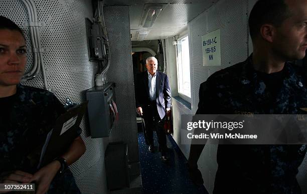 Secretary of Defense Robert Gates walks to the bridge of the USS Abraham Lincoln to visit with the ship's Captain, Captain John Alexander, December...