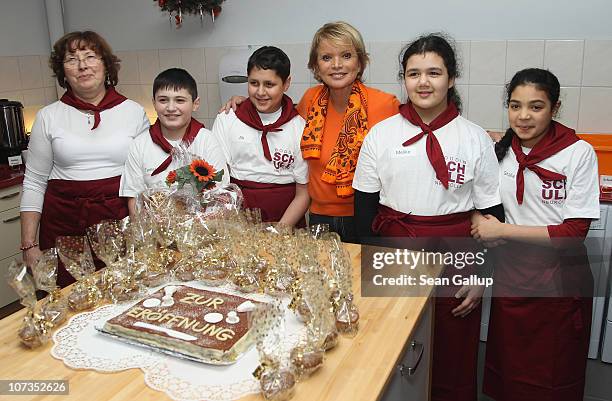 Actress Uschi Glas poses with children in the new breakfast room at the Hermann-Boddin-Grundschule elementary school on December 6, 2010 in Berlin,...