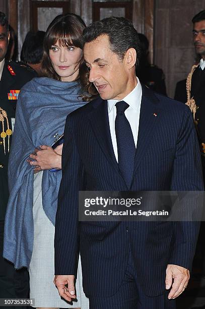 French first lady Carla Bruni-Sarkozy and French President Nicolas Sarkozy arrive at the Rashtrapati Bhavan on December 6, 2010 in New Delhi, India....