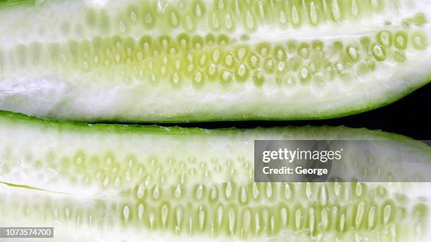 cucumber cut in half, close-up - cucumber foto e immagini stock