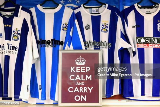 General view of various Huddersfield Town home kits and a Keep Calm and Carry on sign during the Premier League match at the John Smith's Stadium,...