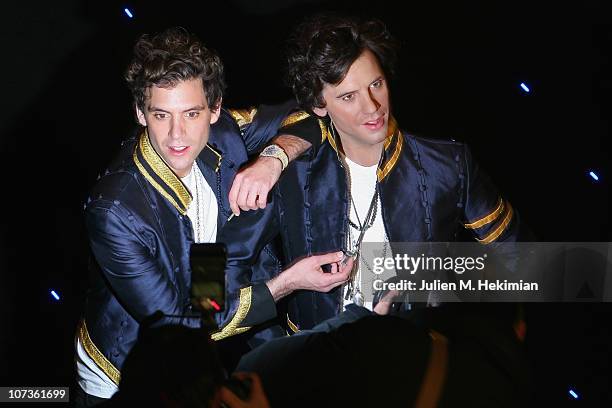 Mika poses with his waxwork at Musee Grevin on December 6, 2010 in Paris, France.