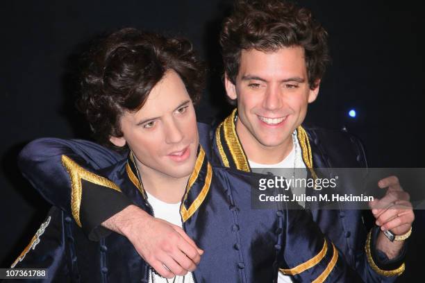 Mika poses with his waxwork at Musee Grevin on December 6, 2010 in Paris, France.