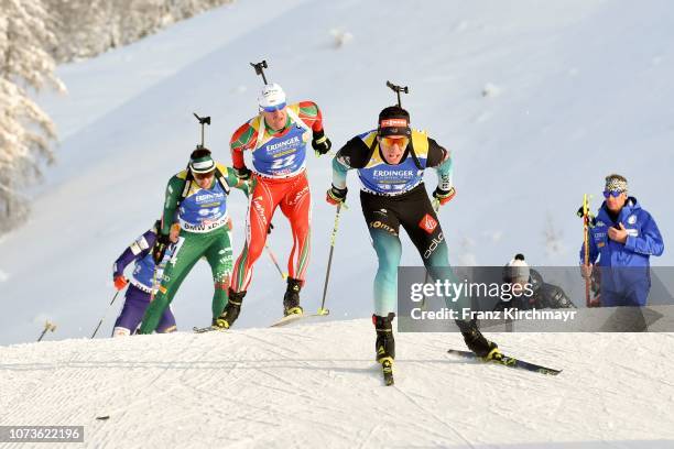 Krasimir Anev of Bulgaria and Quentin Fillon Maillet of France during the Men 12.5 km Pursuit Competition at Biathlon Stadium Hochfilzen on December...