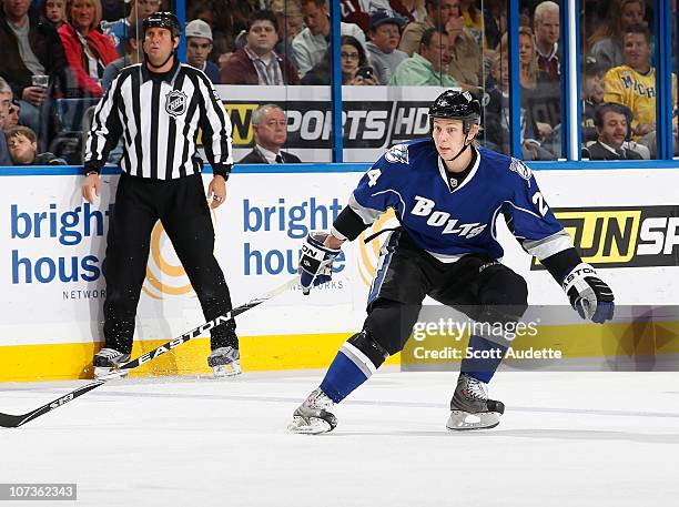 Johan Harju of the Tampa Bay Lightning defends against the Colorado Avalanche at the St. Pete Times Forum on December 4, 2010 in Tampa, Florida.