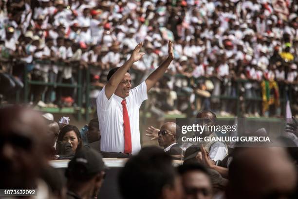 Malagasy Presidential candidate Marc Ravalomanana gestures as he arrives to address tens of thousands of his supporters during a campaign rally on...