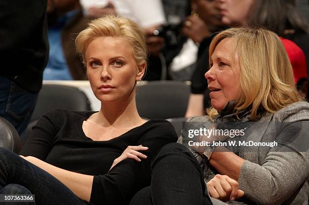 Celebrity actress Charlize Theron with mother Gerda sitting courtside during Los Angeles Clippers vs New Orleans Hornets game at Staples Center.Los...