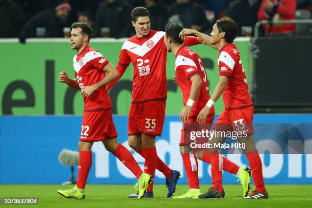 Kaan Ayhan of Fortuna Duesseldorf celebrates after scoring his team's second goal with his team mates during the Bundesliga match between Fortuna...