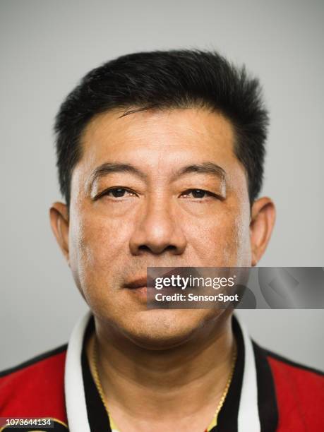 real chinese mature man with blank expression - chinese indonesians stock pictures, royalty-free photos & images