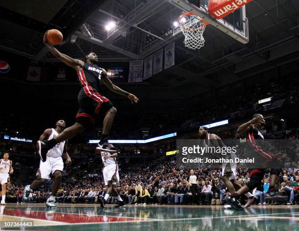LeBron James of the Miami Heat goes up for a dunk against the Milwaukee Bucks at the Bradley Center on December 6, 2010 in Milwaukee, Wisconsin. NOTE...