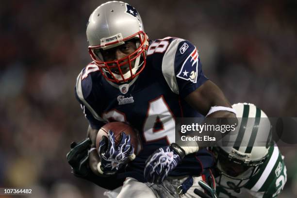 Deion Branch of the New England Patriots scores on a 25-yard touchdown reception in the first quarter against the New York Jets at Gillette Stadium...