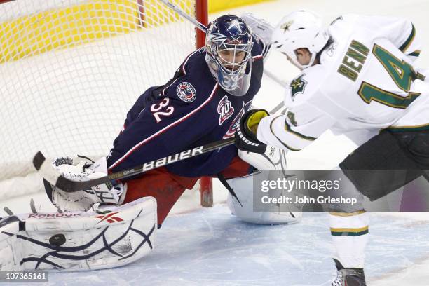 Goaltender Mathieu Garon of the Columbus Blue Jackets blocks a shot from Jamie Benn of the Dallas Stars in a shootout, sealing a victory for Columbus...