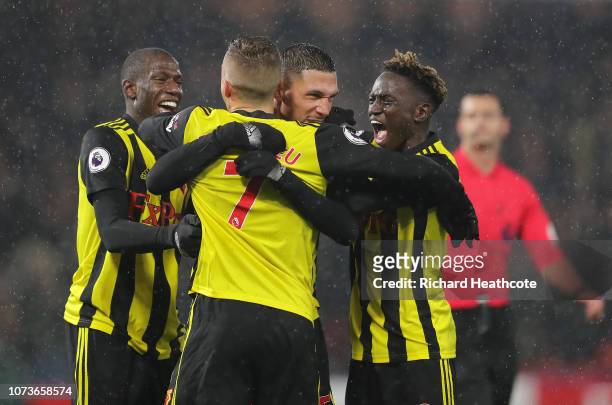 Jose Holebas of Watford celebrates with teammates after scoring his team's second goal during the Premier League match between Watford FC and Cardiff...