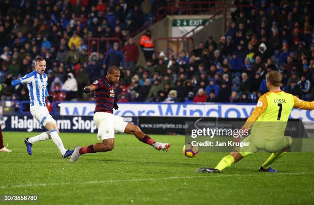 Salomon Rondon of Newcastle United scores his team's first goal during the Premier League match between Huddersfield Town and Newcastle United at...