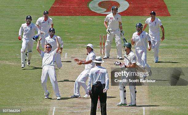 Graeme Swann of England celebrates after dismissing Peter Siddle of Australia to win the match during day five of the Second Ashes Test match between...