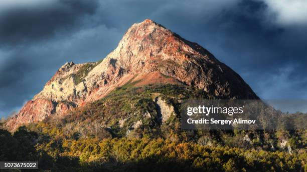 multicoloured mountain peak at hot stream valley in japan - basalt stockfoto's en -beelden