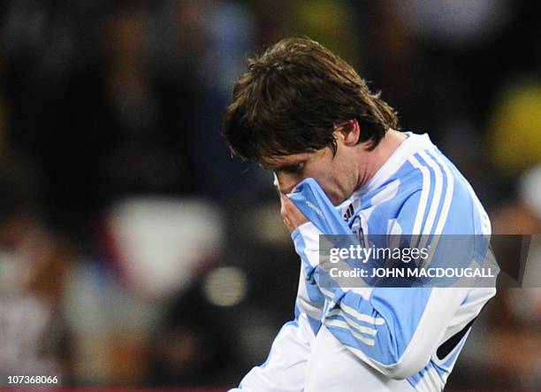 Argentina's striker Lionel Messi walks off the pitch after the quarter final 2010 World Cup match Argentina versus Germany on July 3, 2010 at Green...