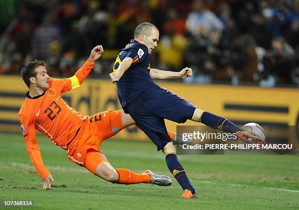 Spain's midfielder Andrés Iniesta shoots and scores a goal during extra time the 2010 FIFA football World Cup final between the Netherlands and Spain...