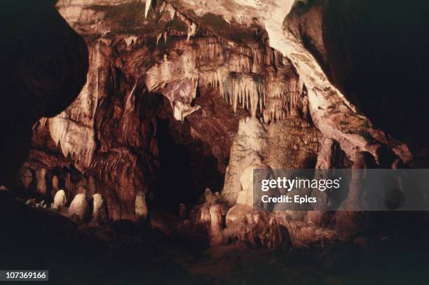 Cave with stalactites is illuminated in Kents Cavern one of the most important prehistoric cave dwellings in England, Torquay, circa 1985.