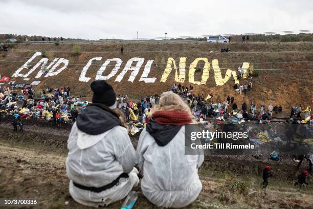 Environmental activist of 'Ende Gelaende' block the rail track of the 'Hambach Bahn' to protest for the preservation of the ancient forest 'Hambacher...