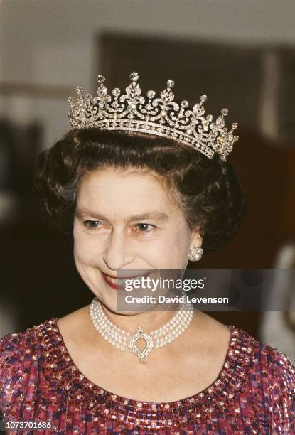 Queen Elizabeth II wears a four strand diamond and pearl choker with 'Granny's Tiara' to a banquet in Bangladesh, 16th November 1983.