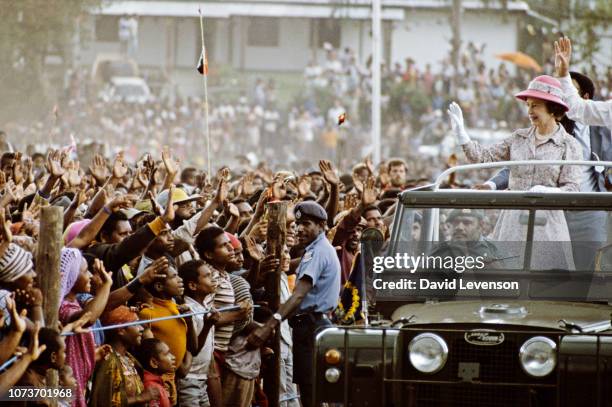 Queen Elizabeth II and Prince Philip arrive at a tribal festival of song and dance, called a 'sing-sing' in Mount Hagen, Papua New Guinea, on October...