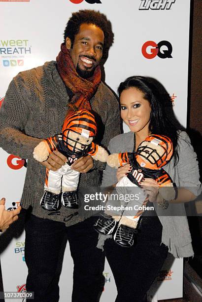 Dhani Jones and Adrienne Bailon attend the 81 Cares Bowl presented by Terrell Owens and GQ Magazine at Star Lanes On The Levee on December 6, 2010 in...