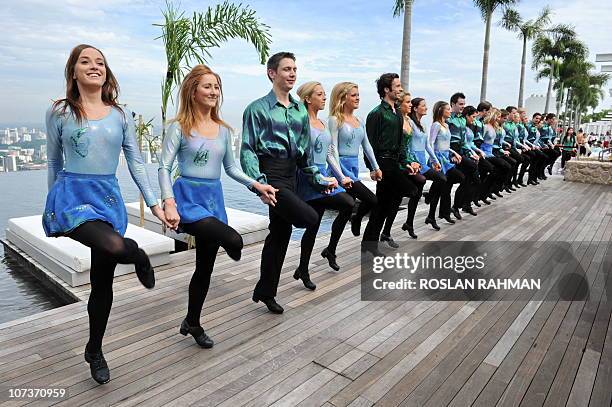 Irish dance troupe, the Riverdance, perform on top of Marina bay Sands' Skypark, 200 metres above ground level in Singapore on December 7, 2010....