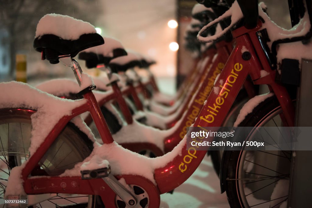Arlington, VA January 22, 2015: Commuter bicycles covered in snow as Winter Storm Jonas bears down o
