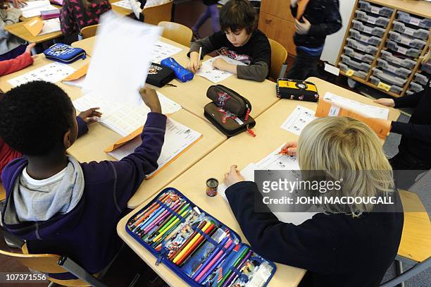 Pupils at work during a math class in a primary school in Berlin December 7, 2010. The three-yearly OECD Programme for International Student...