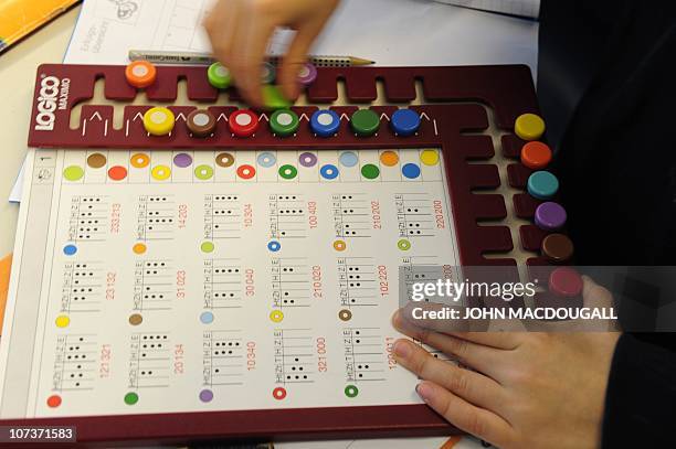 Pupil does math work during a math class in a primary school in Berlin December 7, 2010. The three-yearly OECD Programme for International Student...