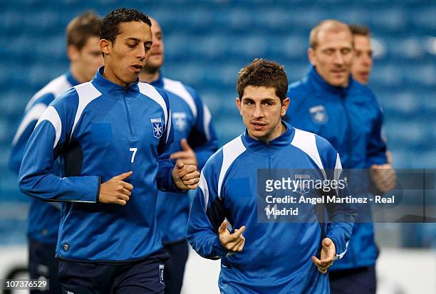 Julien Quercia and Kamel Chafni of AJ Auxerre warm up during a training session at Estadio Santiago Bernabeu, ahead of their UEFA Champions League...