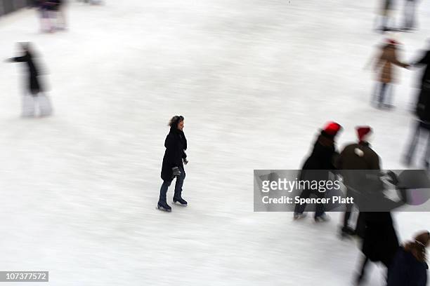 People skate at the ice rink at Rockefeller Center on December 7, 2010 in New York City. New York is in the midst of the holiday tourism and shopping...