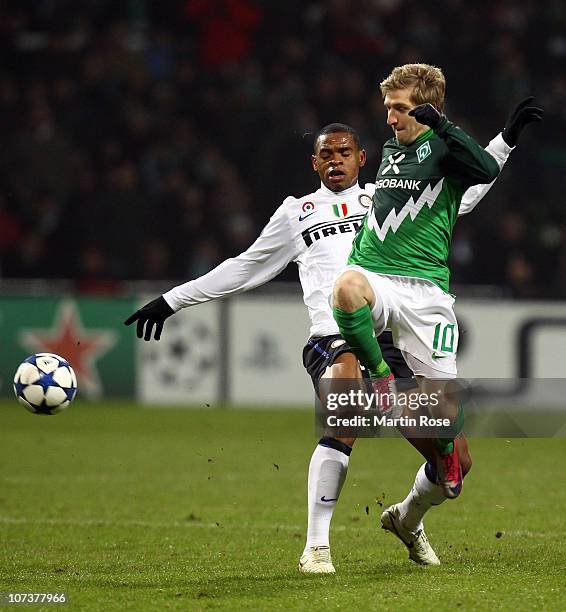 Marko Marin of Bremen and Obiora Nwankwo of Milano compete for the ball during the UEFA Champions League group A match between SV Werder Bremen and...