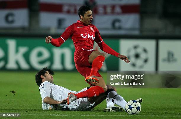 Vedran Corluka of Tottenham challenges Nacer Chadli of Twente during the UEFA Champions League Group A match between FC Twente and Tottenham Hotspur...