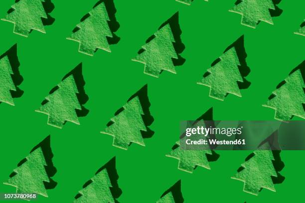 rows of green christmas trees on green ground, 3d rendering - christmas tree close up stock illustrations