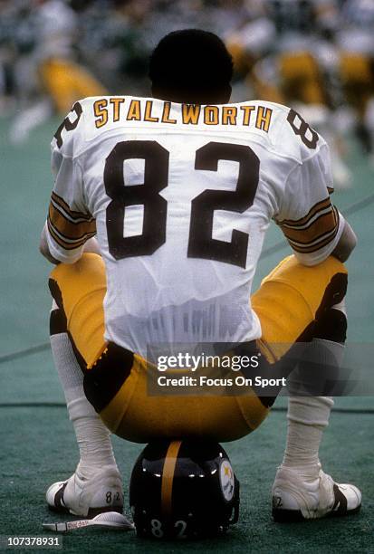 John Stallworth of the Pittsburgh Steelers sitting on his helmet, watching the action from the sidelines against the Philadelphia Eagles during an...