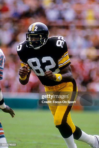 John Stallworth of the Pittsburgh Steelers runs a pass rout against the Miami Dolphins during an NFL football game at The Orange Bowl circa 1985 in...