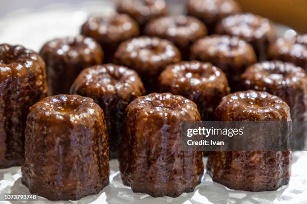 close-up of canele cakes in a row - ribbed stock pictures, royalty-free photos & images